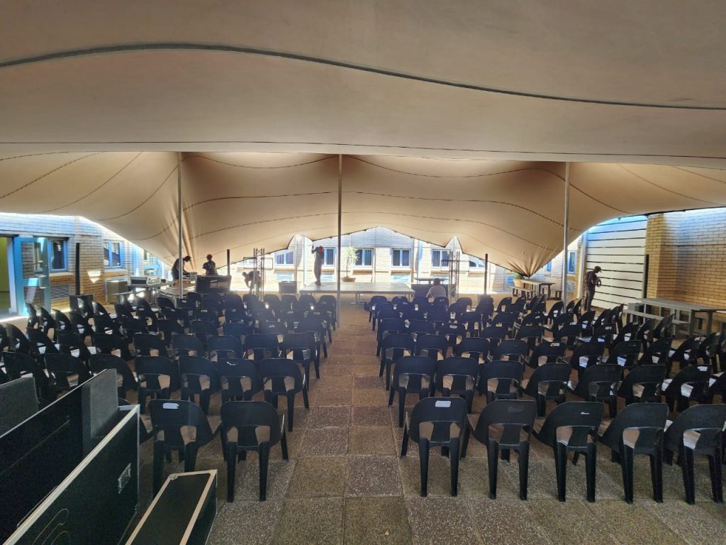 I Just Hired a Tent in South Africa - Here's How 3 Events Guys Hire a large tent equipped with rows of chairs and tables.