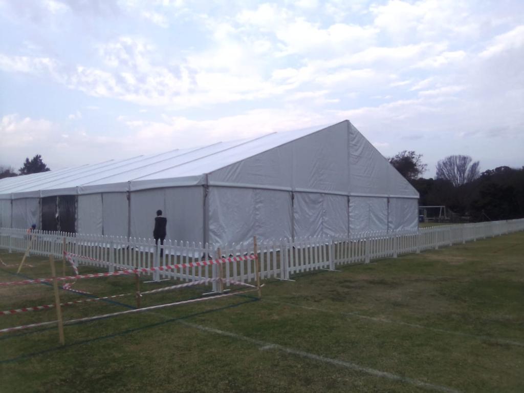 Revel in Your Celebration with Our Tent Hire Party Services 3 Events Guys A white tent with a white picket fence available for equipment hire.